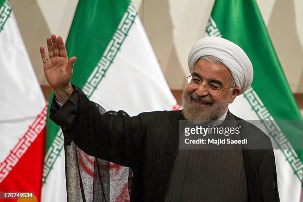 Iran's president elect Hassan Rouhani waves during his first press conference after being elected on June 17, 2013 in Tehran, Iran. Rouhani expressed...