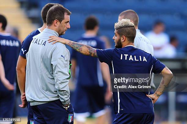 Head coach Devis Mangia and Lorenzo Insigne stand together during an Italy U21 training session at Teddy Stadium ahead of their UEFA European U21...