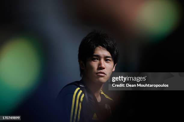 Atsuto Uchida of Japan speaks to the media after the Japan Training Session at the Confederations Cup 2013 at Centro de Capacitacao Fisica dos...