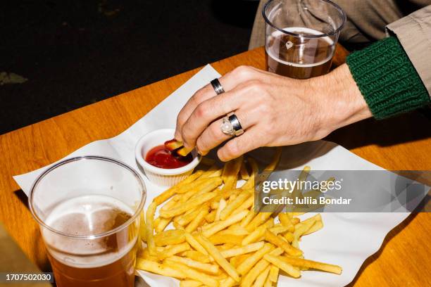 beers and french fries - party retro stock pictures, royalty-free photos & images