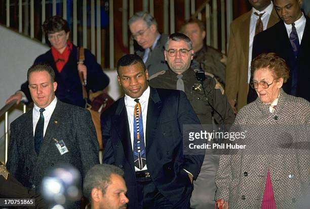Mike Tyson and his surrogate mother, Camille Ewald leaving City-County Building courthouse during his trial regarding rape charges. Indianapolis, IN...