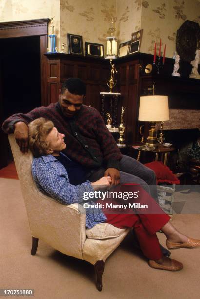 Portrait of Mike Tyson with his surrogate mother, Camille Ewald, during photo shoot in her house. Catskill, NY 12/1/1985 CREDIT: Manny Millan
