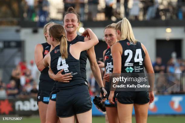 Harriet Cordner of the Blues celebrates the win with team mates during the round five AFLW match between Carlton Blues and Sydney Swans at Ikon Park,...