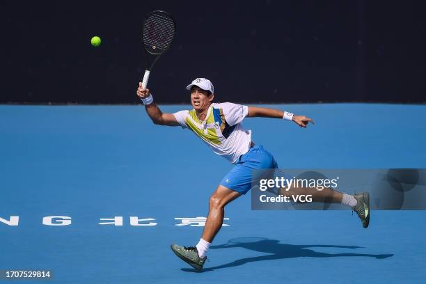 Mackenzie McDonald of the United States returns a shot in the Men's Singles Round of 32 match against Grigor Dimitrov of Bulgaria on day four of 2023...