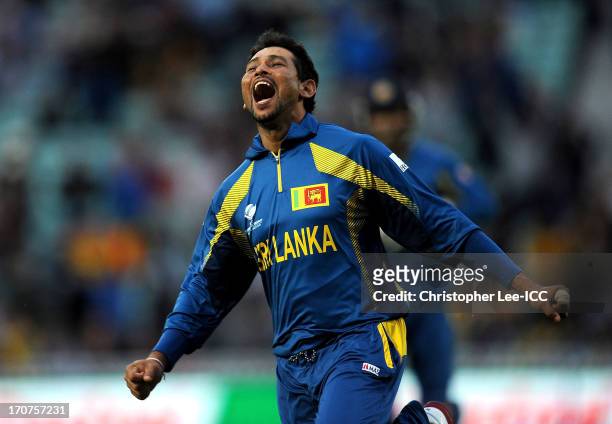 Tillakaratne Dilshan of Sri Lanka celebrates taking the final wicket of Clint McKay of Australia and winning the match during the ICC Champions...