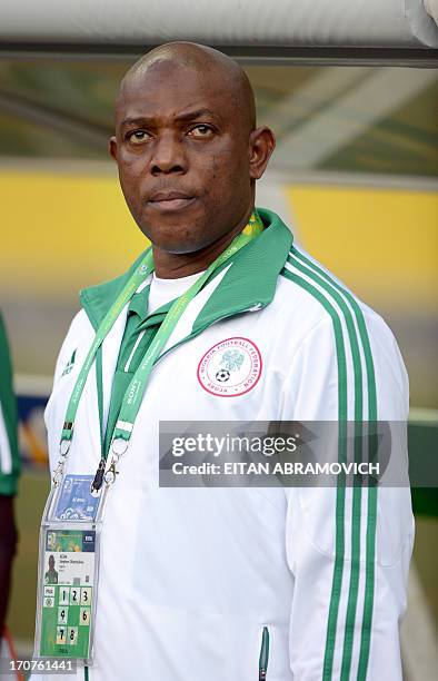 Nigeria's coach Stephen Keshi listens to his national anthem before the start of the FIFA Confederations Cup Brazil 2013 Group B football match...