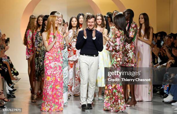 Fashion designer, Georg Lux acknowledges the audience at the end of the Leonard Paris Womenswear Spring/Summer 2024 show as part of Paris Fashion...