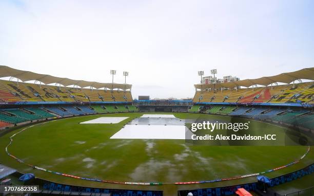 General view inside the stadium as the start of play is delayed due to rain in the ICC Men's Cricket World Cup India 2023 warm up match between South...