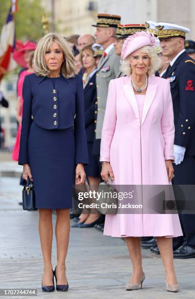 Queen Camilla and Brigitte Macron attend a ceremonial welcome at The Arc De Triomphe on September 20, 2023 in Paris, France. The King and The Queen's...