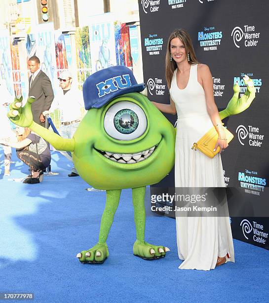 Disney character Mike Wazowski and model Alessandra Ambrosio attend the premiere of Disney Pixar's "Monsters University" at the El Capitan Theatre on...
