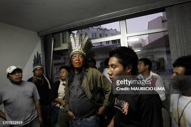 Brazilian natives from different tribes listen to a cacique as they hold a meeting during an occupation inside the National Foundation of Health in...
