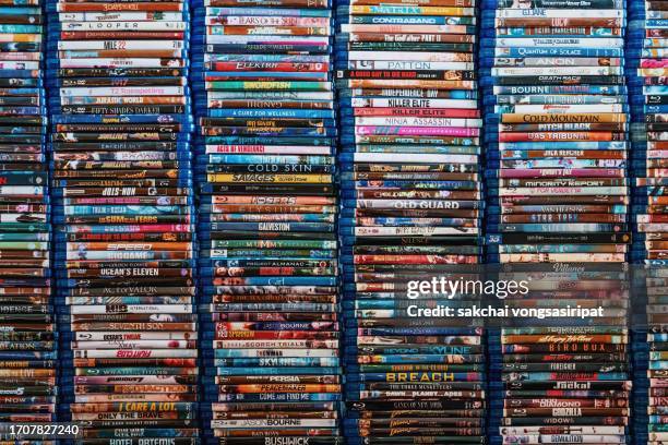 close-up of blu-ray movie discs on shelves - rom ストックフォトと画像