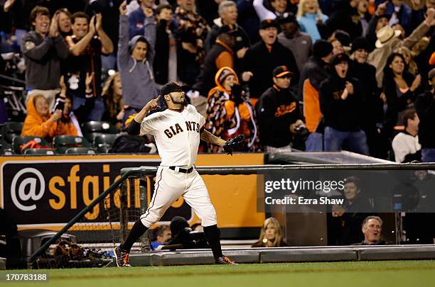 Sergio Romo of the San Francisco Giants reacts after centerfielder Juan Perez of the San Francisco Giants threw out Logan Forsythe of the San Diego...