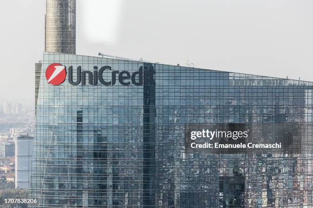 The logo of Italian international banking group UniCredit stands on the facade of the group headquarters, located in the Porta Nuova district, as...