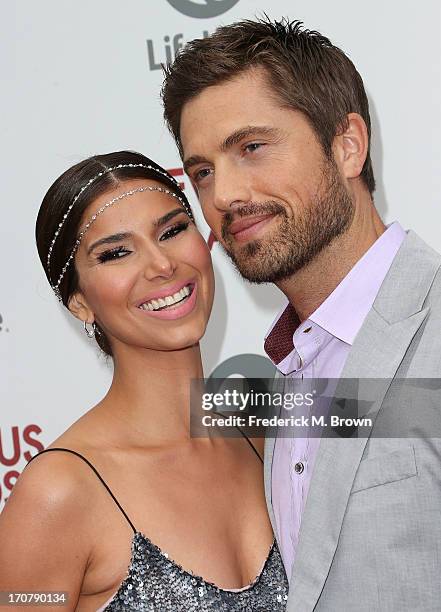 Actress Roselyn Sanchez and her guest attend the premiere party of Lifetime Original Series "Devious Maids" at the Bel-Air Bay Club on June 17, 2013...