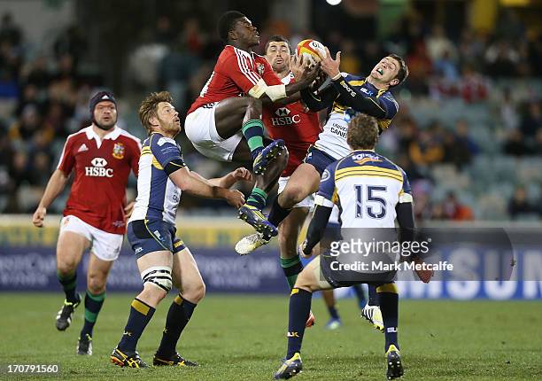 Christian Wade of the Lions competes for the ball in the air with Ian Prior of the Brumbies during the International tour match between the ACT...