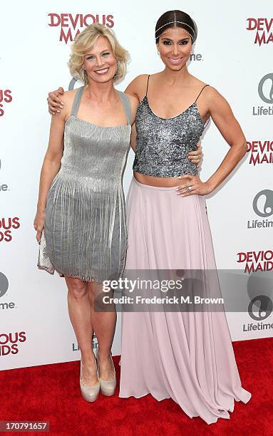 Actresses Roselyn Sanchez and Melinda Page Hamilton attend the premiere party of Lifetime Original Series "Devious Maids" at the Bel-Air Bay Club on...