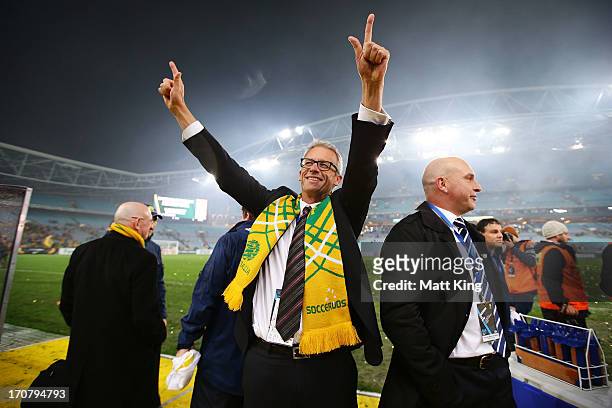 David Gallop celebrates and waves to fans after the Socceroos victory during the FIFA 2014 World Cup Asian Qualifier match between the Australian...