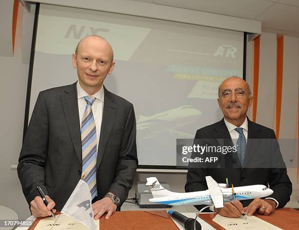 European turboprop manufacturer ATR CEO Filippo Bagnato poses with Danish leasing company Nordic Aviation Capital Chairman Martin Moller after NAC...