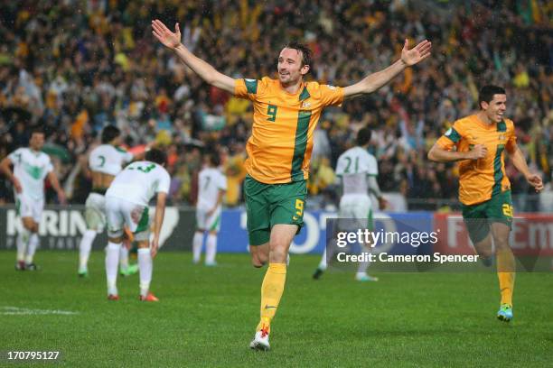 Josh Kennedy of the Socceroos celebrates heading the ball to score a goal during the FIFA 2014 World Cup Asian Qualifier match between the Australian...