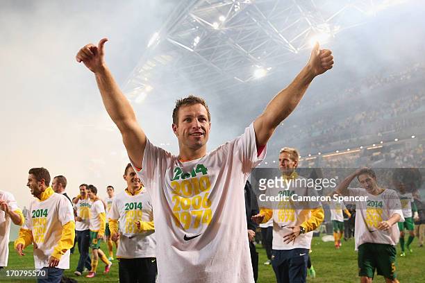 Socceroos captain Lucas Neill thanks fans after winning the FIFA 2014 World Cup Asian Qualifier match between the Australian Socceroos and Iraq at...