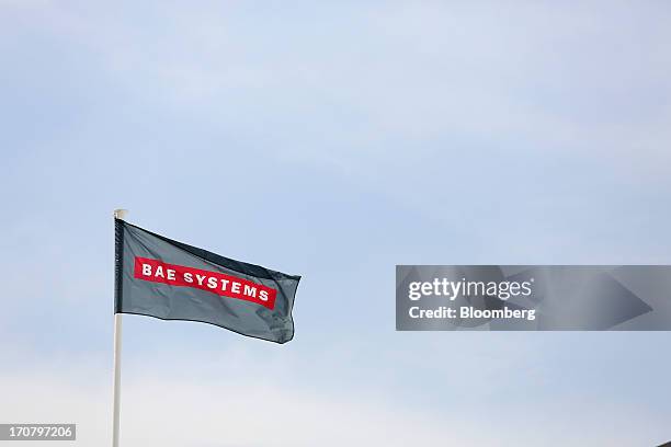 Logo sits on a flag as it flies above the BAE Systems Plc's chalet on the second day of the Paris Air Show in Paris, France, on Tuesday, June 18,...