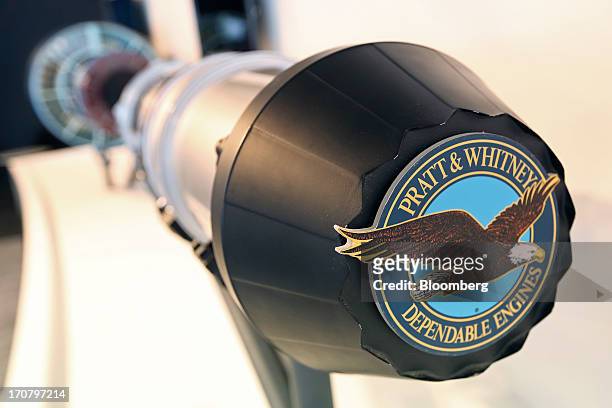Logo sits on an aircraft engine display on the the Pratt & Whitney's stand, a unit of United Technologies Corp., on the second day of the Paris Air...