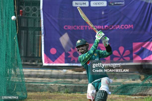 Pakistan's captain Babar Azam bats in nets during a practice session on the eve of their 2023 ICC men's cricket World Cup one-day international match...