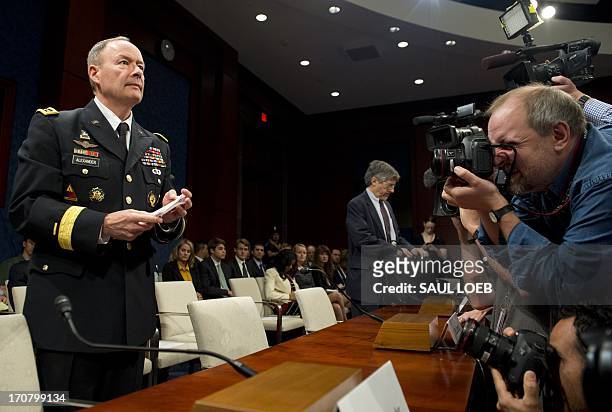 National Security Agency Director General Keith Alexander arrives to testify before the House Select Intelligence Committee on the NSA's PRISM...