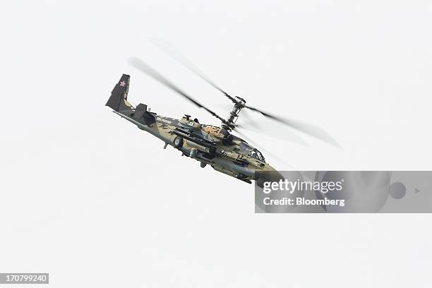 Military helicopter, manufactured by Kamov, a unit of OAO Russian Helicopters performs in a flying display on the second day of the Paris Air Show in...