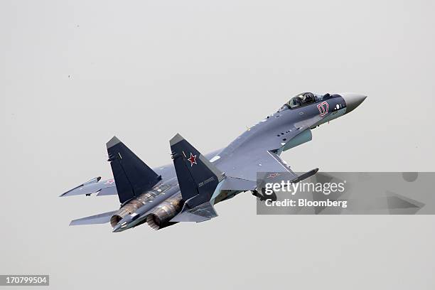 Sukhoi Co. Holding OAO SU-35 fighter jet performs in a flying display on the second day of the Paris Air Show in Paris, France, on Tuesday, June 18,...