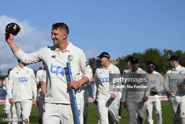 Durham captain Scott Borthwick leads his team off the pitch after Durham won the Second Division Title after the final day of the LV= Insurance...