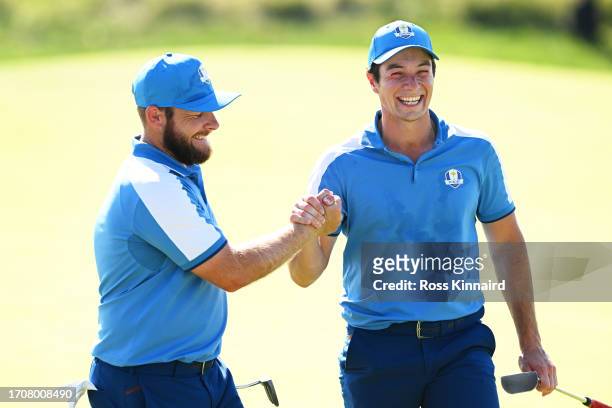 Tyrrell Hatton and Viktor Hovland of Team Europe celebrate on the 11th hole during the Friday afternoon fourball matches of the 2023 Ryder Cup at...