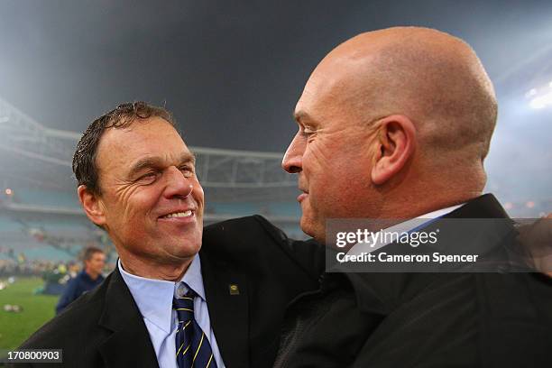 Socceroos coach Holger Osieck is congratulated by commentator Andy Harper during the FIFA 2014 World Cup Asian Qualifier match between the Australian...