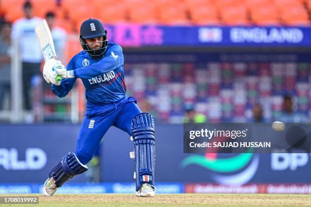 England's Adil Rashid plays a shot during the 2023 ICC men's cricket World Cup one-day international match between England and New Zealand at the...
