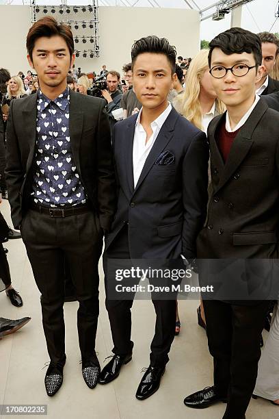 Bolin Chen, Chen Kun and Khalil Fong attend the front row at Burberry Menswear Spring/Summer 2014 at Kensington Gardens on June 18, 2013 in London,...