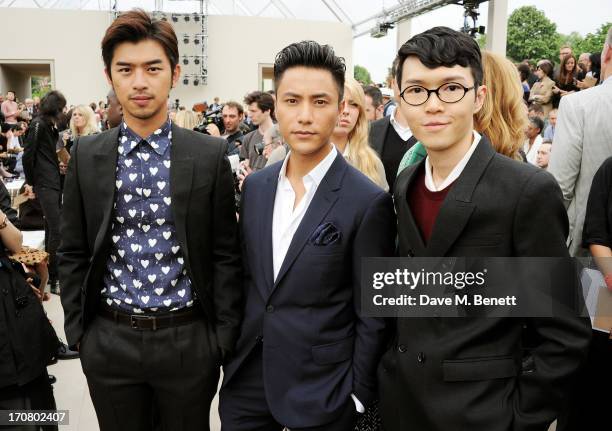 Bolin Chen, Chen Kun and Khalil Fong attend the front row at Burberry Menswear Spring/Summer 2014 at Kensington Gardens on June 18, 2013 in London,...