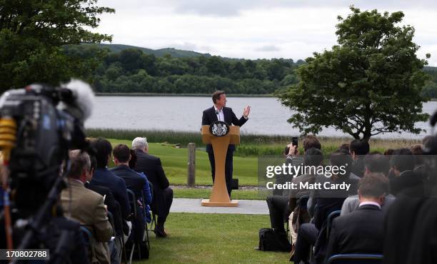 Britain's Prime Minister David Cameron, answers questions from the media at a concluding press conference at the G8 venue of Lough Erne on June 18,...