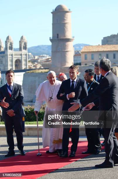 Pope Francis participates in the final session of the Rencontres Mediterraneennes in the Palais du Pharo. The Holy Father is welcomed by the...