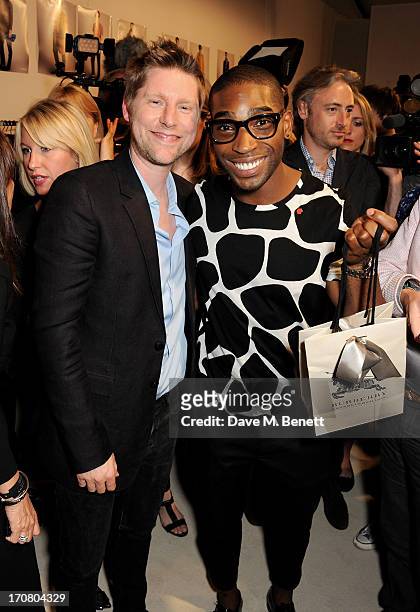 Burberry Chief Creative Officer Christopher Bailey and Tinie Tempah pose backstage at Burberry Menswear Spring/Summer 2014 at Kensington Gardens on...
