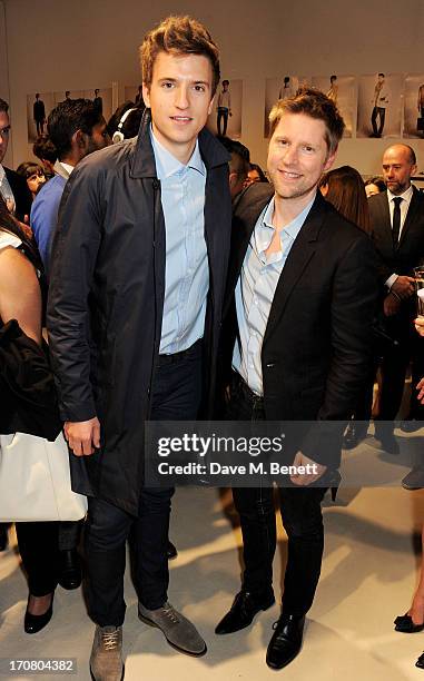 Greg James and Burberry Chief Creative Officer Christopher Bailey pose backstage at Burberry Menswear Spring/Summer 2014 at Kensington Gardens on...