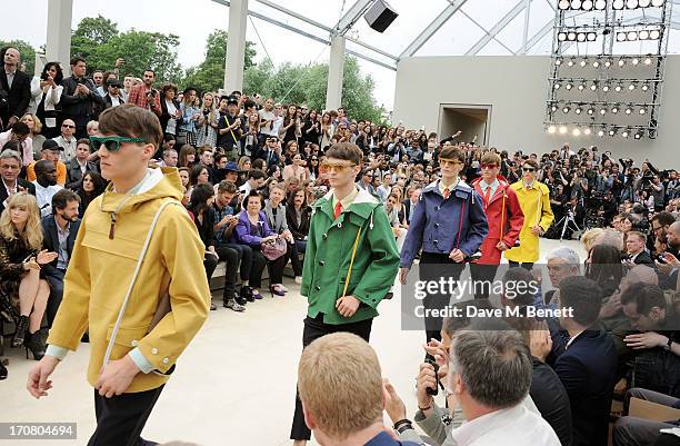 Guests including Suki Waterhouse, Hugh Dancy, Sergio Pizzorno, guest, Suzy Menkes, Jefferson Hack and Ben Cobb sit in the front row at Burberry...