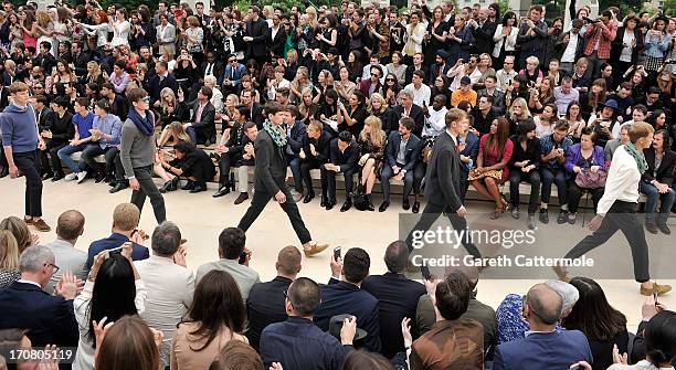 General view of the finale at Burberry Menswear Spring/Summer 2014 at Kensington Gardens on June 18, 2013 in London, England.