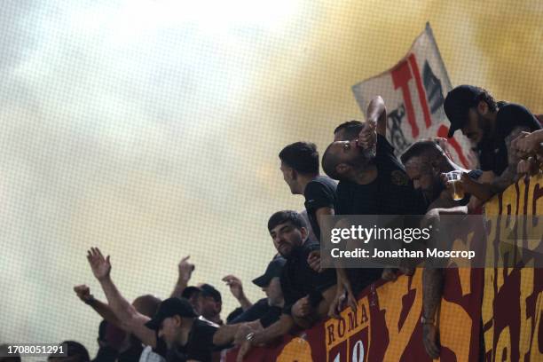 Roma fans cheer on their team during the Serie A TIM match between Genoa CFC and AS Roma at Stadio Luigi Ferraris on September 28, 2023 in Genoa,...