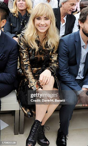 Suki Waterhouse sits in the front row at Burberry Menswear Spring/Summer 2014 at Kensington Gardens on June 18, 2013 in London, England.