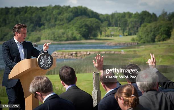 Britain's Prime Minister David Cameron, answers questions from the media at a concluding press conference at the G8 venue of Lough Erne on June 18,...