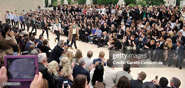 General view of the finale at Burberry Menswear Spring/Summer 2014 at Kensington Gardens on June 18, 2013 in London, England.