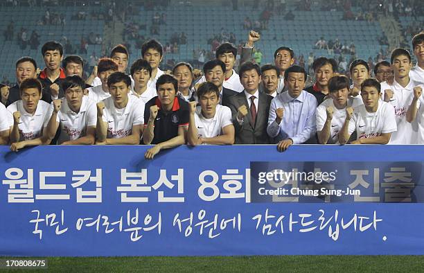 South Korean team celebrate qualifying for the 2014 FIFA World Cup following the FIFA 2014 World Cup Qualifier match between South Korea and Iran at...