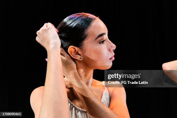 young ballerina preparing to dance at stage theater - theatre dressing room stock pictures, royalty-free photos & images