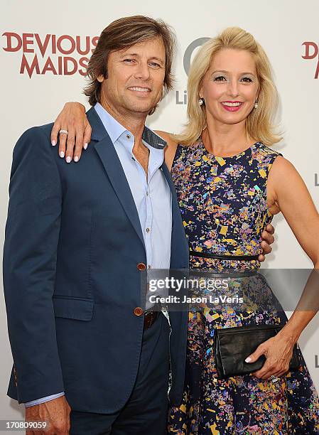 Actor Grant Show and actress Katherine LaNasa attend the premiere of "Devious Maids" at Bel-Air Bay Club on June 17, 2013 in Beverly Hills,...